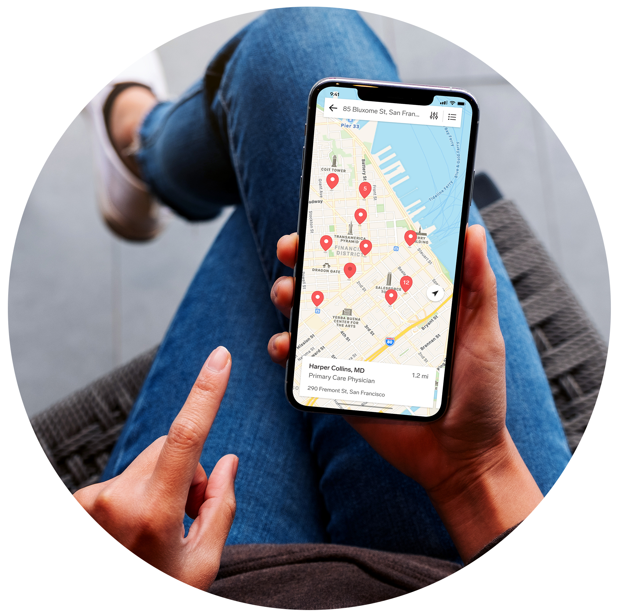 woman-sitting-holding-phone-with-provider-map-screen-v2-2